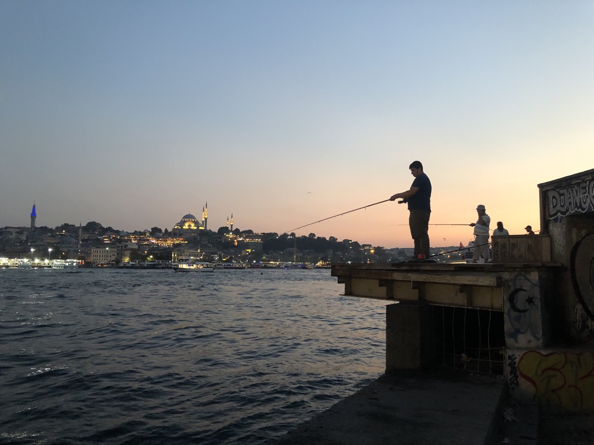 Fishermen on the shore of the Bosporus River as it flows through Istanbul. (August 2022)